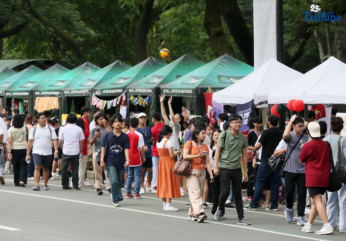 On the second day of school, students visit different organizations during the University of the Philippines Freshie Month Org Fair in front of Palma Hall at the UP Diliman campus in Quezon City on Tuesday, August 12, 2025.