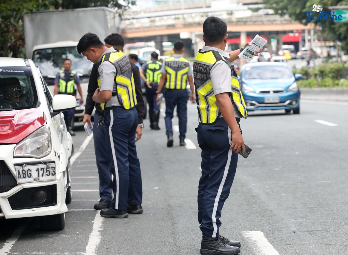 (August 15 2025) Authorities from Land Transportation Office LTO, Metro Pacific Tollways Corporation (MPTC), and Highway Patrol Group HPG combine to conduct an inspection and distribute flyers for road safety manual to the motorists along East Avenue in Quezon City, on Friday August 15 2025. Photo/Analy Labor