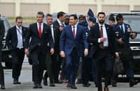 US Defense Secretary Pete Hegseth (C, L) and Secretary of State Marco Rubio (C, R) walk on the tarmac upon arrival at Joint Base Elmendorf-Richardson in Anchorage, Alaska, on August 15, 2025. US President Donald Trump is in Anchorage for a summit with Russian leader Vladimir Putin.