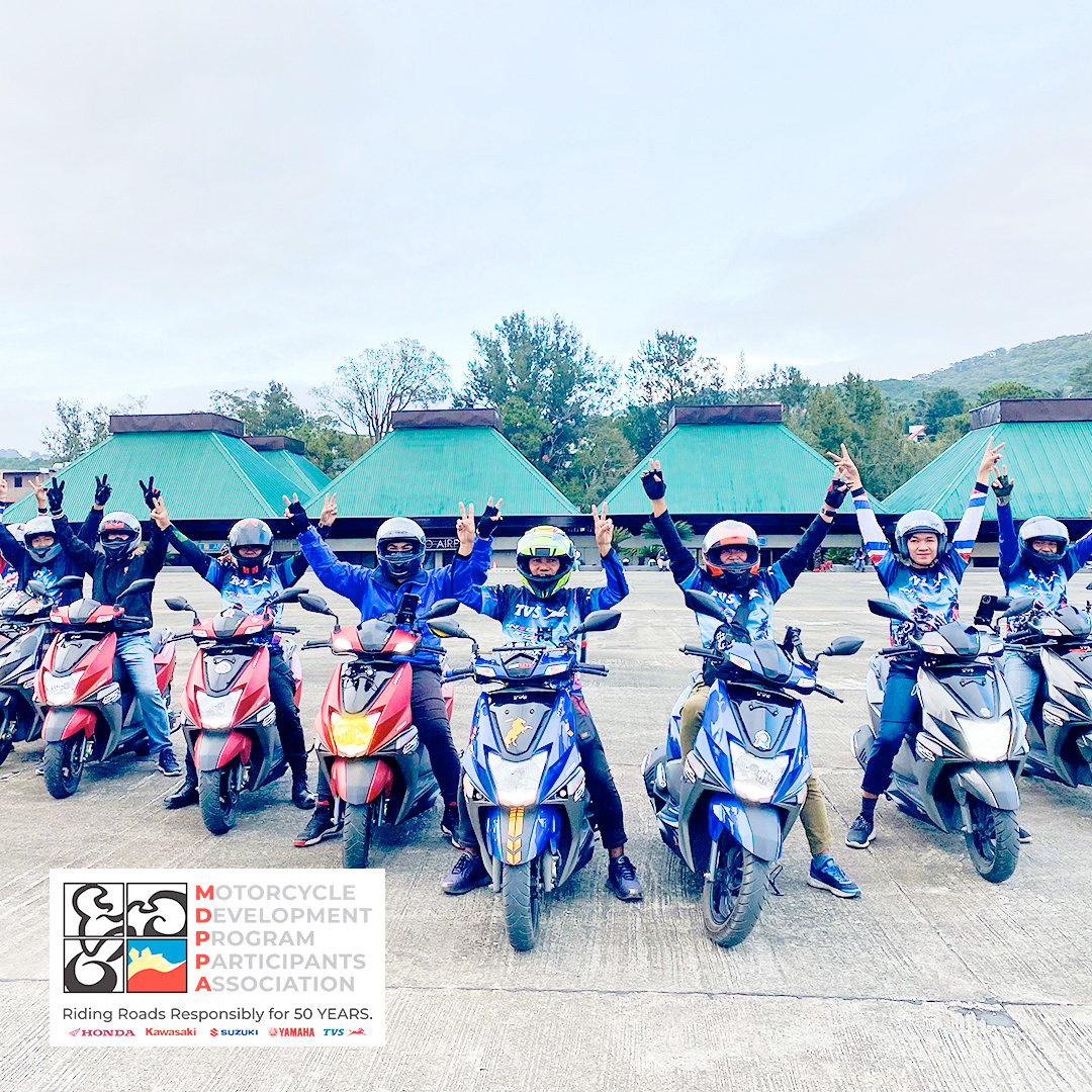 A SUZUKI motorcade rolls through the city, reflecting the everyday role of motorcycles in urban mobility.