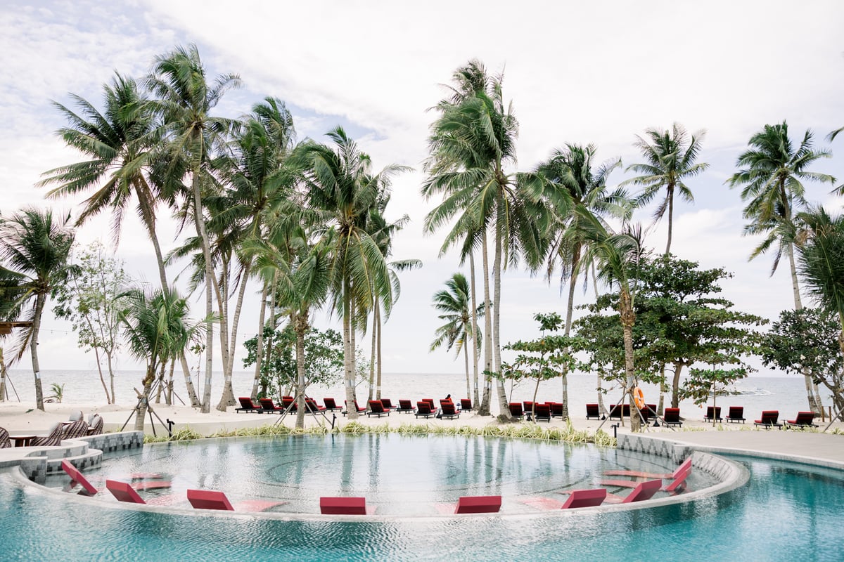 In the south of Panglao Island, the Philippines beach hotel is dotted with coconut palms and backed by tropical hills.