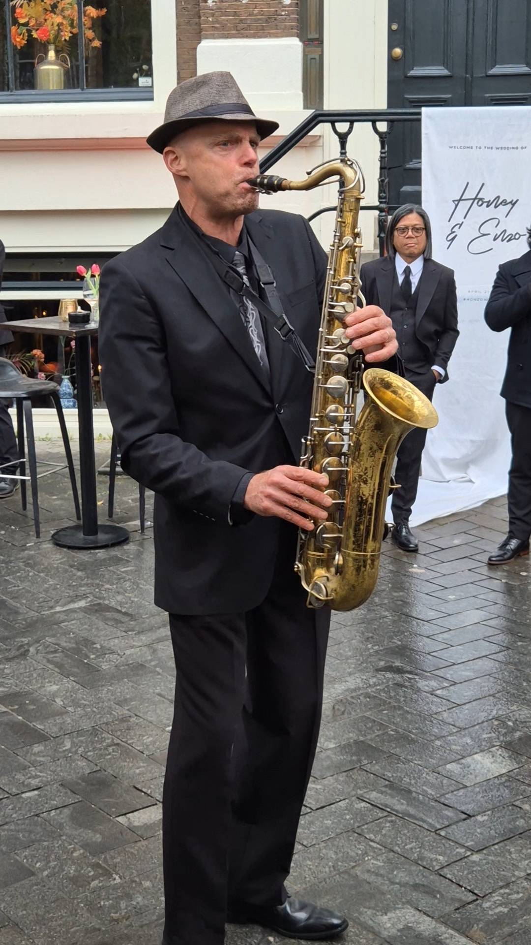 Saxophonist Tal Berlinsky playing during cocktails.