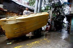 Kids find joy in the rain on rescue boat in Caloocan