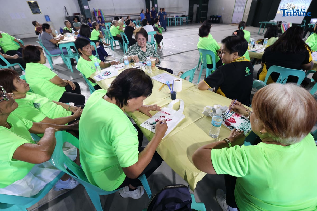 Barangay San Antonio, in partnership with the Rizal Medical Center Geriatric Care Center, held a wellness activity for seniors to promote physical and mental well-being, underscoring the community’s commitment to fostering healthier and happier lives for the elderly. In the photo, senior citizens of Barangay San Antonio, Pasig City, showcase their creativity and vitality as they paint bags and join physical activities during the first anniversary of the Elderly Day Care Program.