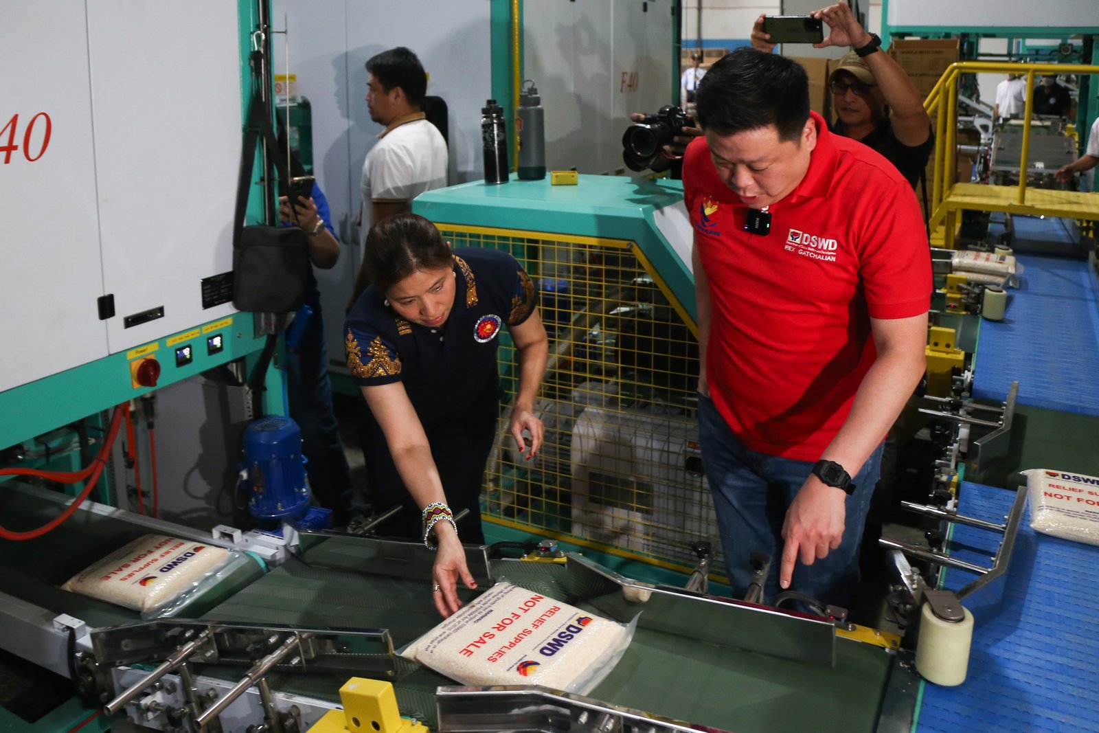 Social Welfare and Development Secretary Rex Gatchalian, joined by Budget and Management Secretary Amenah Pangandaman, inspects the DSWD Family Food Pack warehouse in Parañaque City on the morning of August 19, 2025. The facility serves as a key staging area for the distribution of relief goods to communities in need.