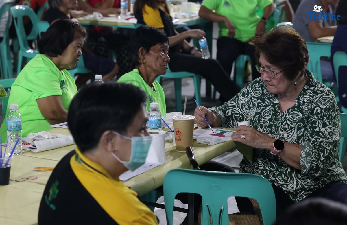 Barangay San Antonio, in partnership with the Rizal Medical Center Geriatric Care Center, held a wellness activity for seniors to promote physical and mental well-being, underscoring the community’s commitment to fostering healthier and happier lives for the elderly. In the photo, senior citizens of Barangay San Antonio, Pasig City, showcase their creativity and vitality as they paint bags and join physical activities during the first anniversary of the Elderly Day Care Program.