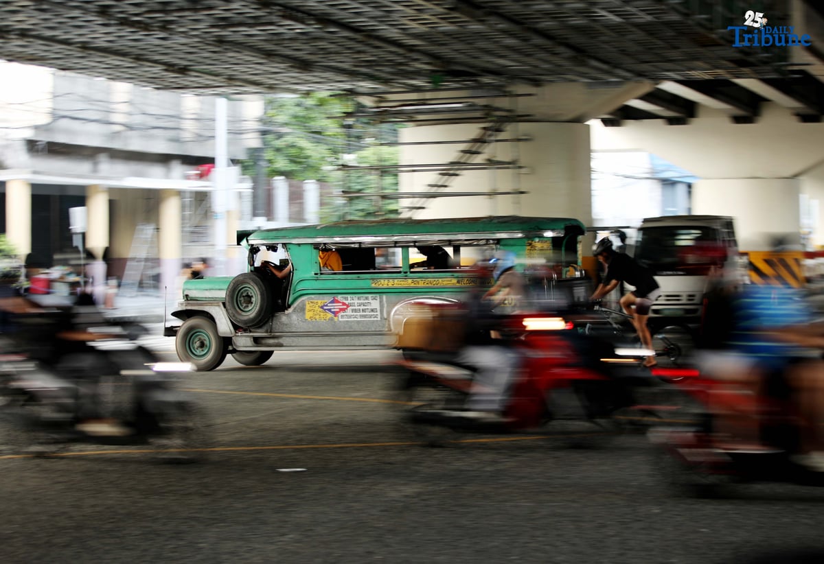 Public utility jeepneys ply along EDSA in Quezon City on Tuesday. The Land Transportation Franchising and Regulatory Board (LTFRB) has given transport groups a non-extendible 10-day deadline to submit their position papers on the proposed ₱1 provisional fare hike for jeepneys.