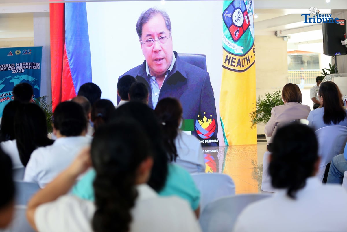 Department of Health Secretary Teodoro J. Herbosa delivers a message on hepatitis via screen to show support for QCitizens during the launch of the Hepatitis B and C Model of Care. The program was led by the Quezon City Health Department (QCHD) and the Office of the City Mayor (OCM), in partnership with Strengthening the Integrated Treatment and Care for Hepatitis (StITCH), as part of the World Hepatitis Day 2025 celebration.