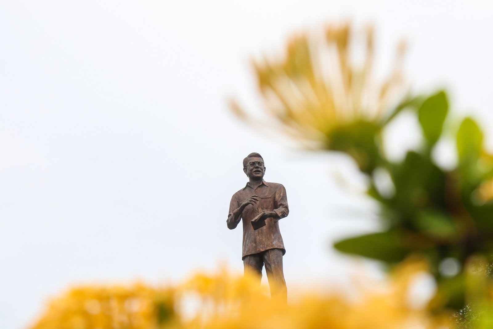 Tourist Police on bike patrol pause at the Ninoy and Cory Aquino Monument at Roxas Boulevard and Padre Burgos Avenue on Ninoy Aquino Day, August 21, 2025. Filipinos mark the 42nd anniversary of the late senator’s assassination.