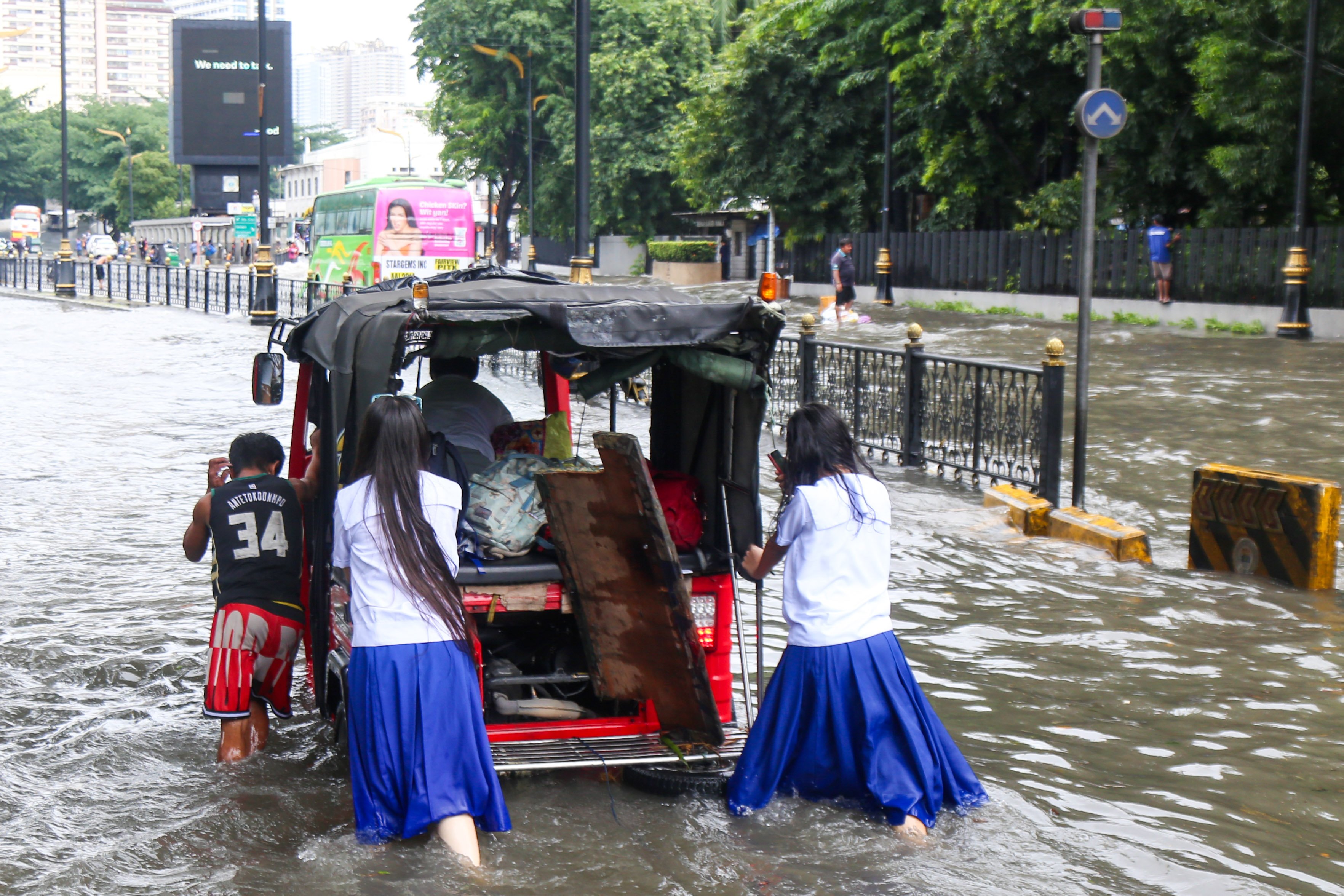 Where is the outrage? This is the Philippines in the eyes of many, struggling through floods, if not traffic. In the capital city, motor vehicles and stranded passengers wade through flooded streets after some rains on Friday, 22 August. With characteristic humor, Filipinos manage to laugh at discomforts as shown in these photos, even as revelations continue to be made on anomalous flood control projects by the Department of Public Works and Highways, its contractors, with alleged imprimatur from some local and national leaders.