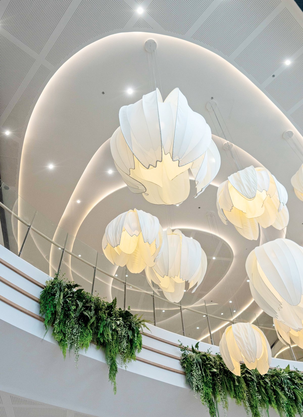 More than just another retail space, SM City Laoag is a visual and emotional homage to Ilocos Norte’s distinct character and natural beauty. The mall’s coastal desert-inspired interiors evoke the shifting silhouettes of the Laoag sand dunes, captured in flowing curves, warm earth tones and organic shapes throughout the structure. Sunlight gently pours through an Inabel-inspired skylight — a nod to the region’s iconic handwoven textile. This feature does more than honor tradition; it also supports sustainability by maximizing the mall’s use of natural daylight, in tune with Laoag’s nickname, the Sunshine City.
