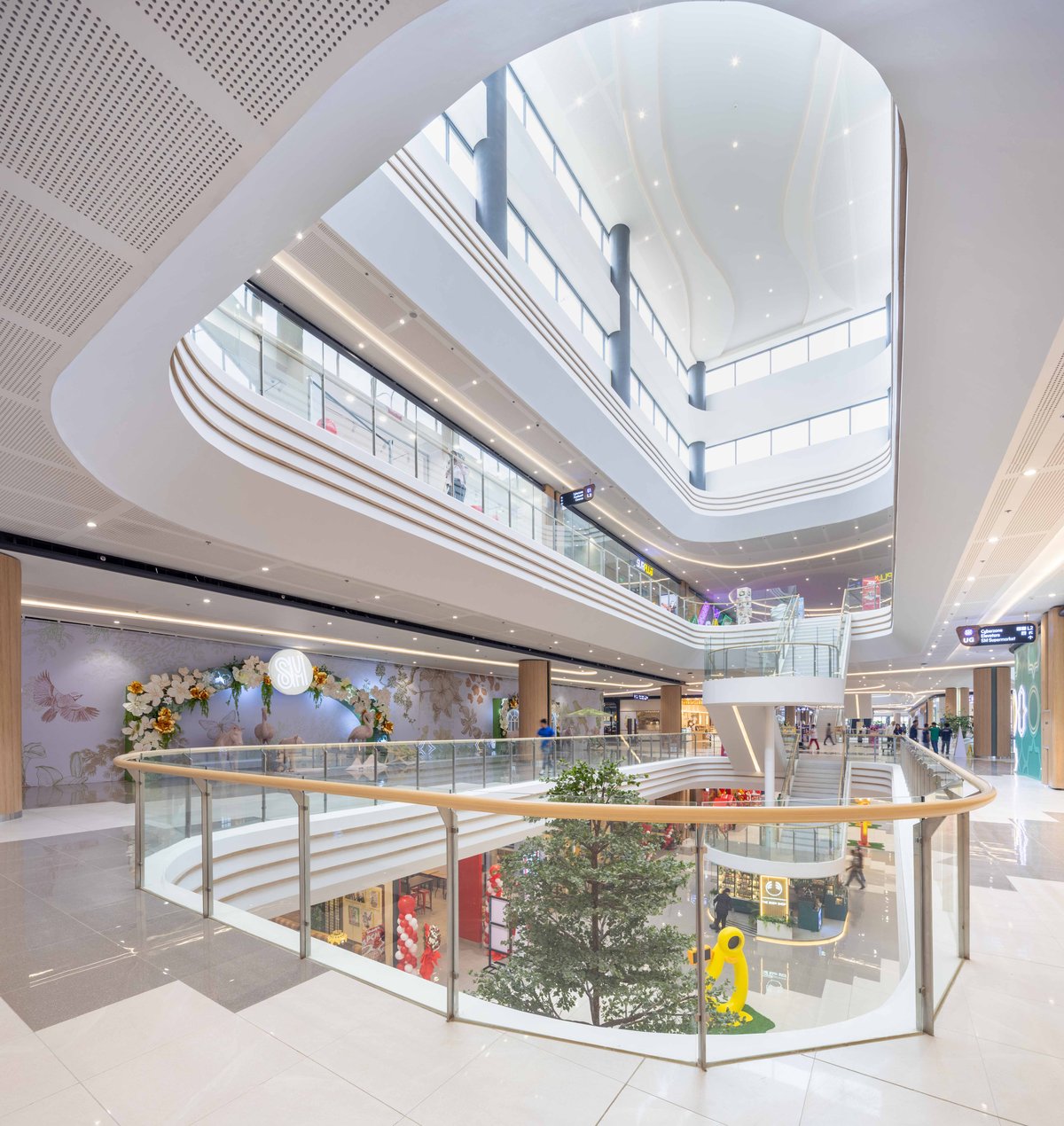 More than just another retail space, SM City Laoag is a visual and emotional homage to Ilocos Norte’s distinct character and natural beauty. The mall’s coastal desert-inspired interiors evoke the shifting silhouettes of the Laoag sand dunes, captured in flowing curves, warm earth tones and organic shapes throughout the structure. Sunlight gently pours through an Inabel-inspired skylight — a nod to the region’s iconic handwoven textile. This feature does more than honor tradition; it also supports sustainability by maximizing the mall’s use of natural daylight, in tune with Laoag’s nickname, the Sunshine City.