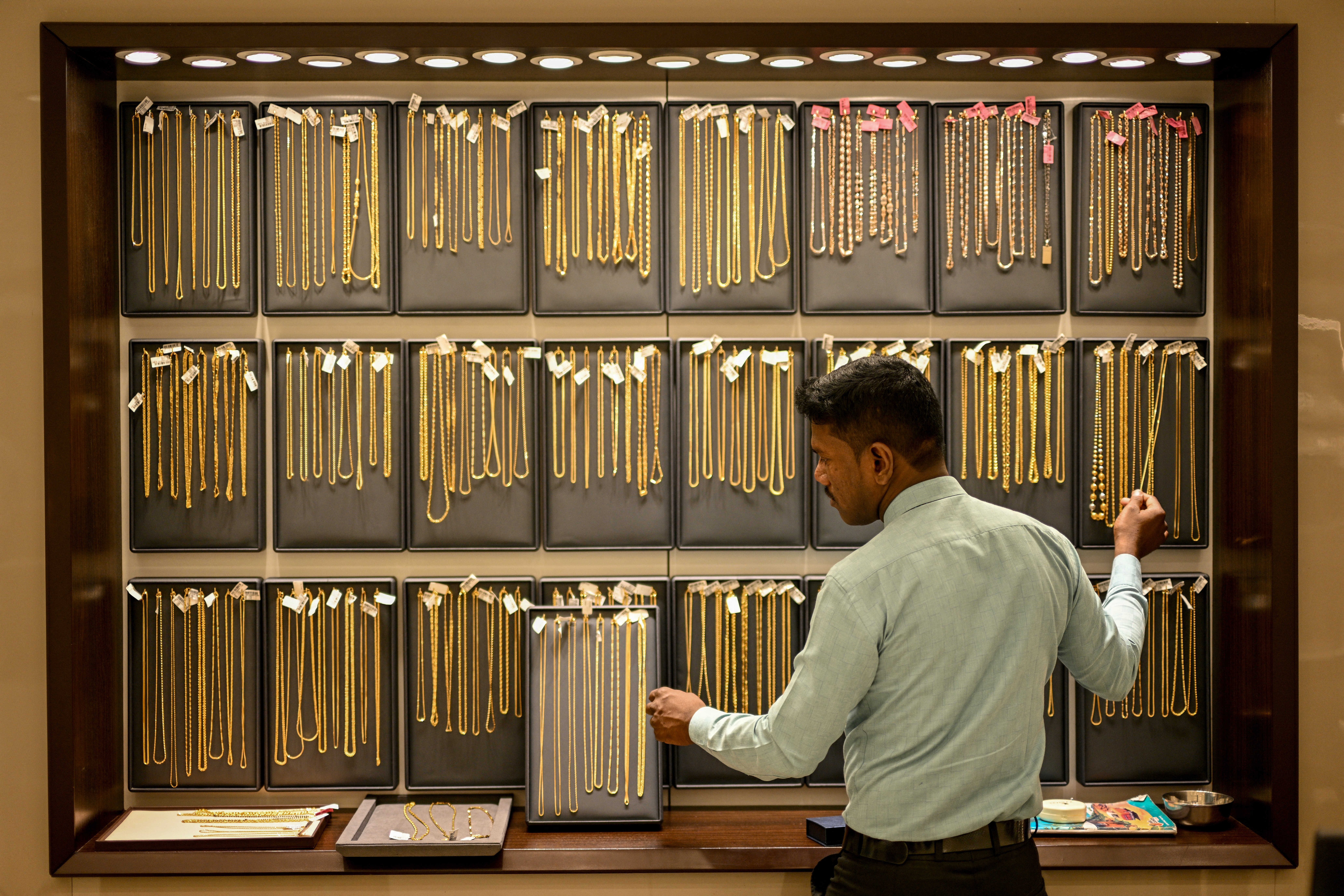 Gold prices dip as strong dollar offsets Fed rate-cut hopes