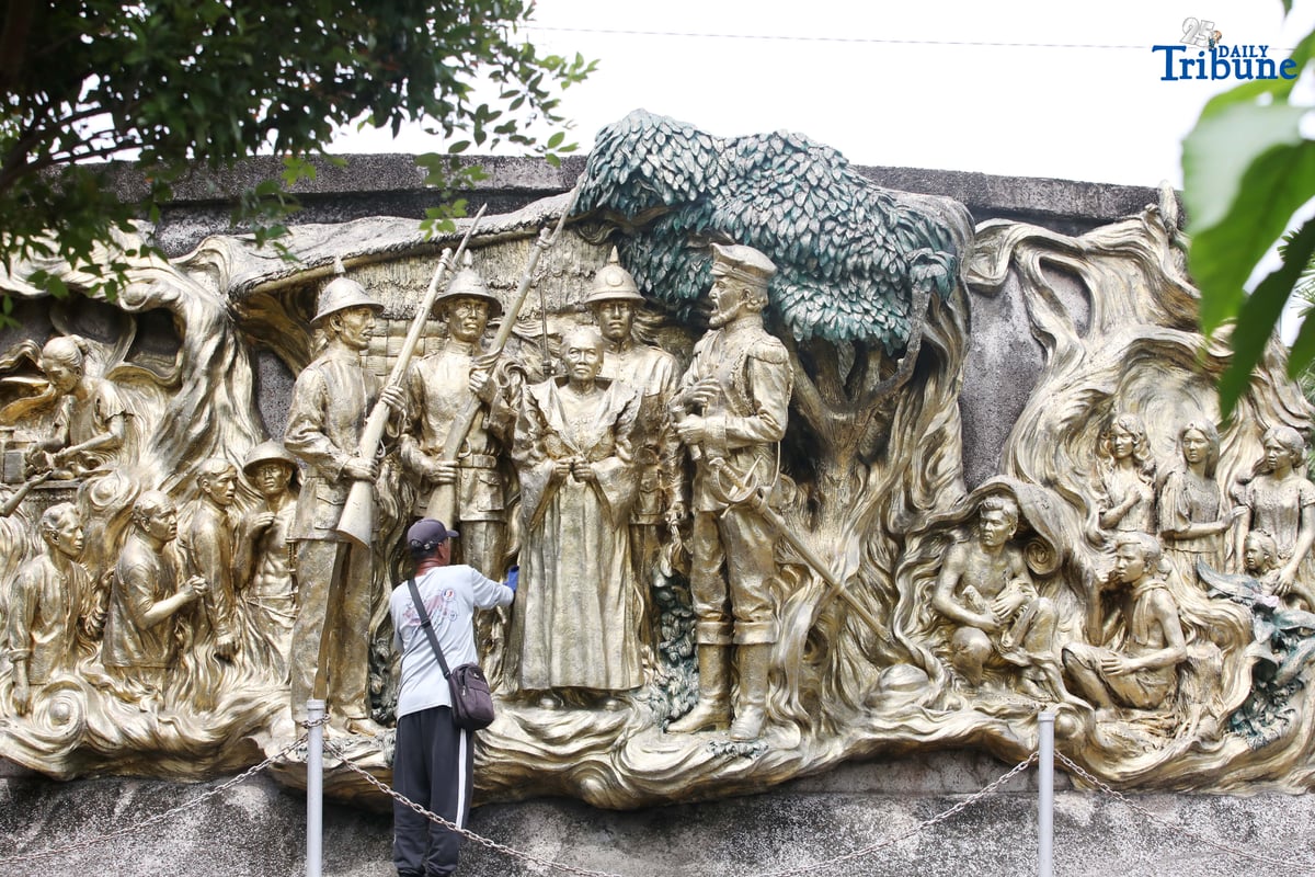 A caretaker cleans the two-sided mural sculpture of Philippine heroine Tandang Sora, known as the “Grand Old Lady of the Philippine Revolution,” who cared for wounded revolutionaries during the struggle for independence. The mural is located inside Himlayang Pilipino Memorial Park in Quezon City, where the tribute was done on Monday, 25 August 2025, as the nation marked National Heroes Day.
