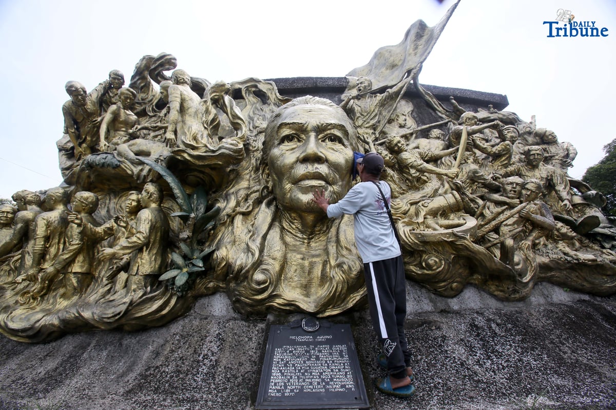 A caretaker cleans the two-sided mural sculpture of Philippine heroine Tandang Sora, known as the “Grand Old Lady of the Philippine Revolution,” who cared for wounded revolutionaries during the struggle for independence. The mural is located inside Himlayang Pilipino Memorial Park in Quezon City, where the tribute was done on Monday, 25 August 2025, as the nation marked National Heroes Day.