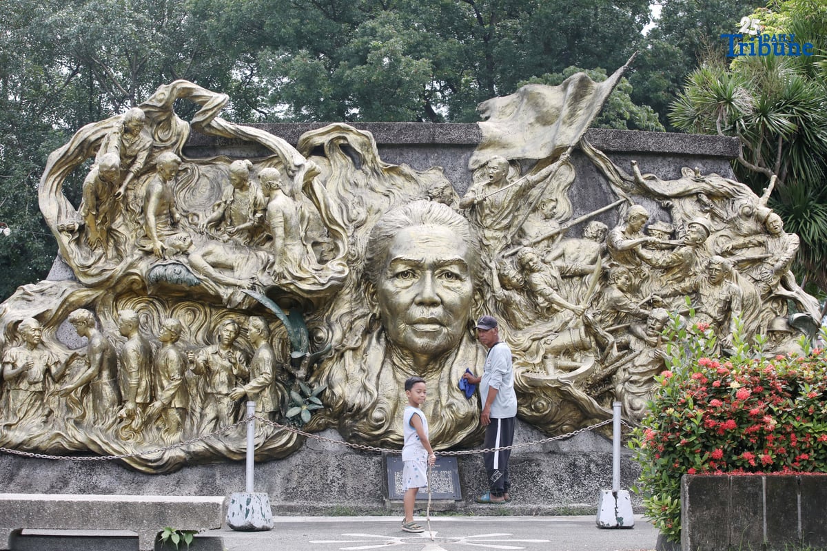 A caretaker cleans the two-sided mural sculpture of Philippine heroine Tandang Sora, known as the “Grand Old Lady of the Philippine Revolution,” who cared for wounded revolutionaries during the struggle for independence. The mural is located inside Himlayang Pilipino Memorial Park in Quezon City, where the tribute was done on Monday, 25 August 2025, as the nation marked National Heroes Day.