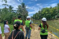 Officials from the Development Bank of the Philippines lead an on-site inspection along the banks of the Lo-om River to assess the ongoing infrastructure works aimed at mitigating flood risks and strengthening community resilience against climate-related hazards.
