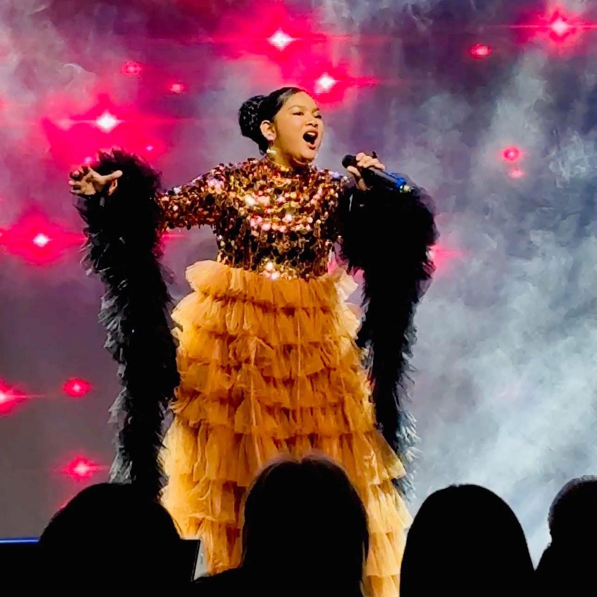 Filipina shines in int'l singing tilt