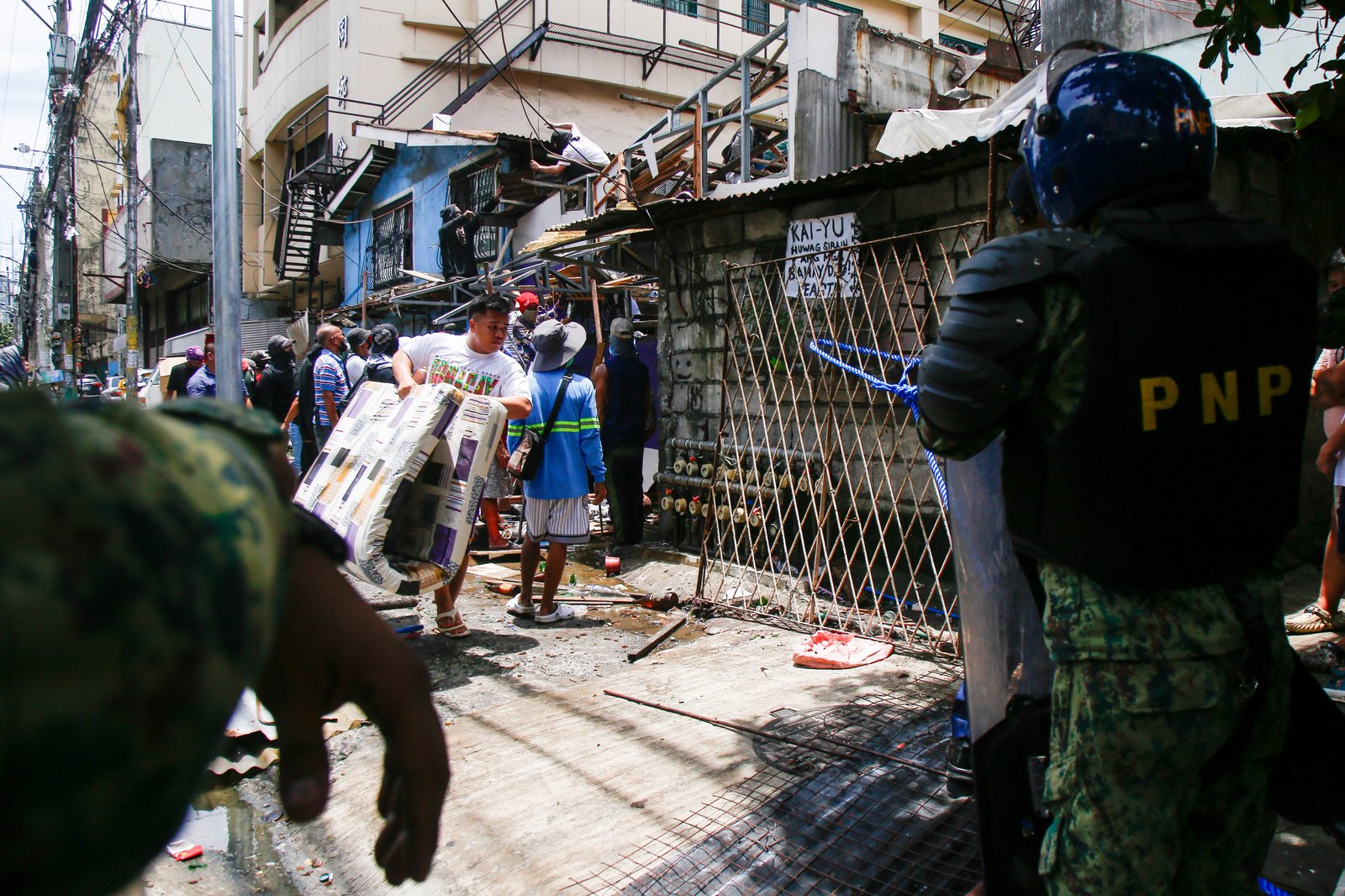 Tension rises amid demolition in Barangay 227, Jose Abad Santos Avenue in Tondo, Manila, on 28 August 2025, as residents clash with the demolition team and police officers.