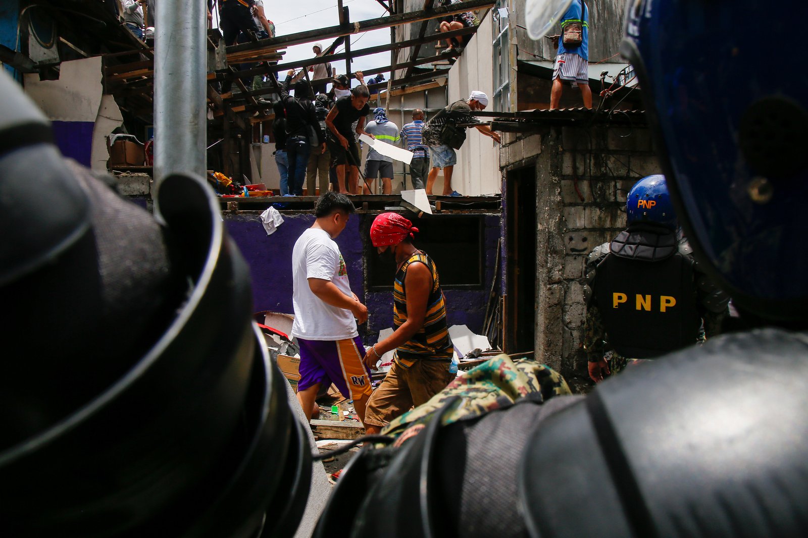 Tension rises amid demolition in Barangay 227, Jose Abad Santos Avenue in Tondo, Manila, on 28 August 2025, as residents clash with the demolition team and police officers.