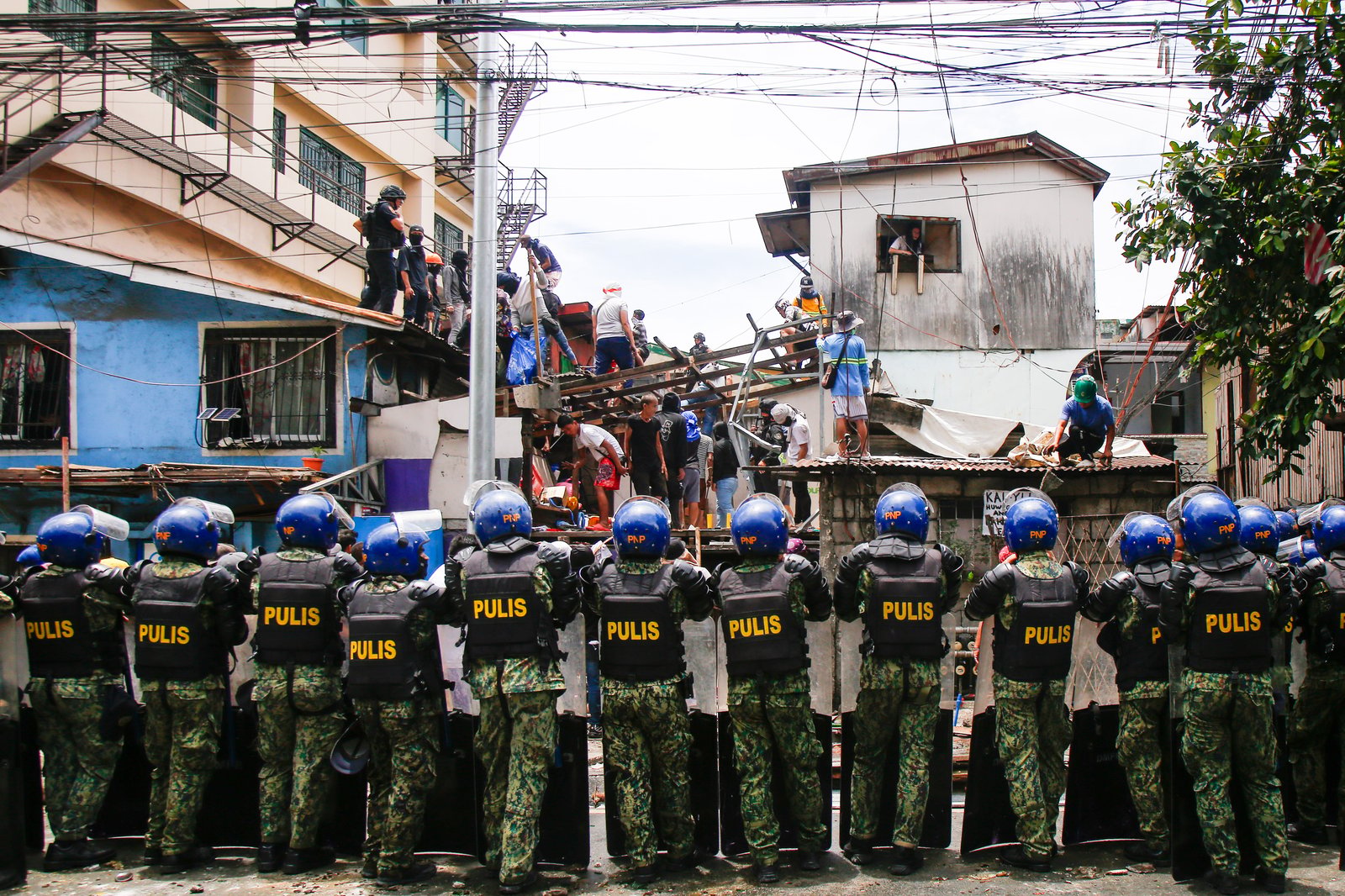 Tension rises amid demolition in Barangay 227, Jose Abad Santos Avenue in Tondo, Manila, on 28 August 2025, as residents clash with the demolition team and police officers.