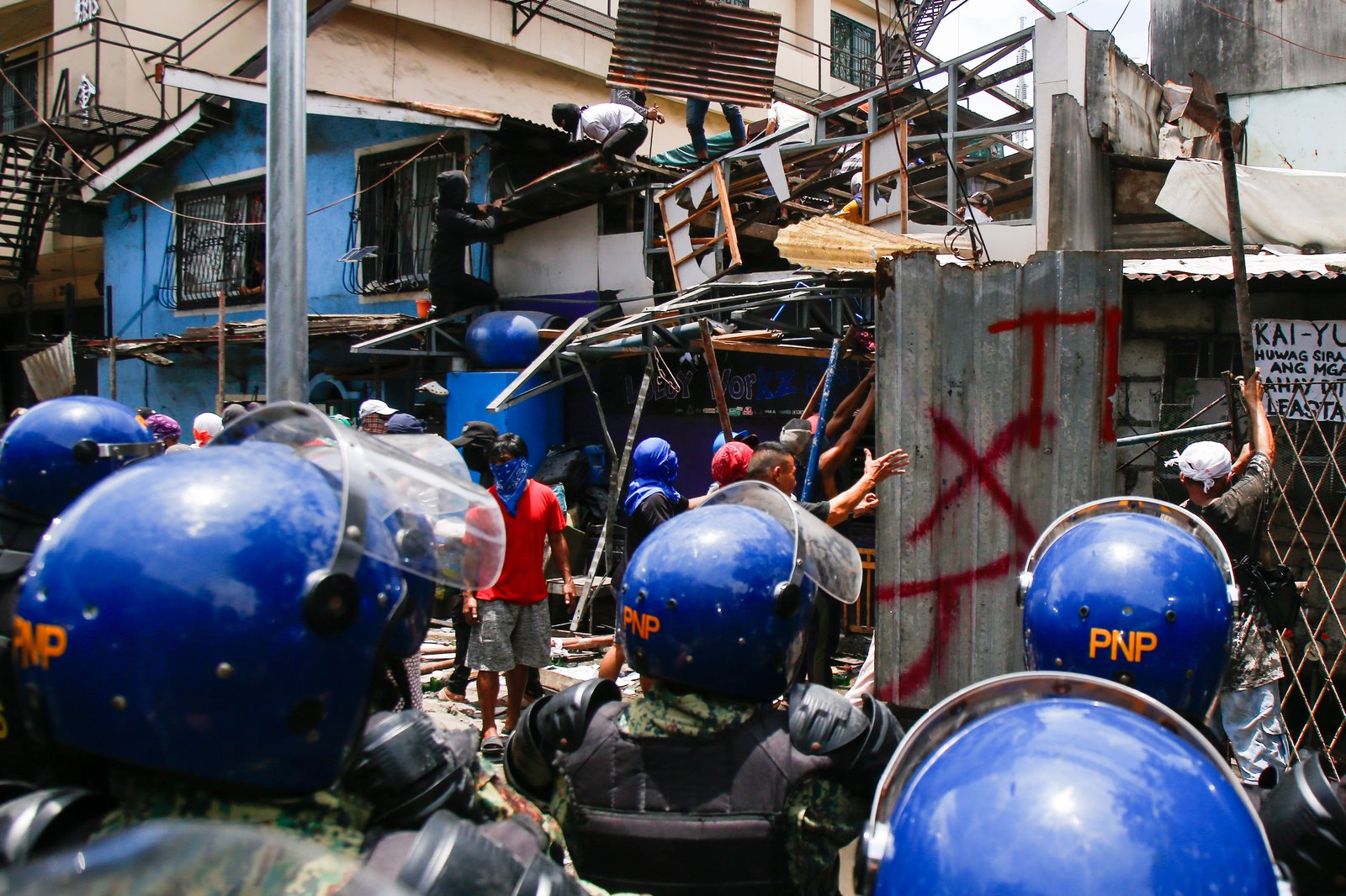 Tension rises amid demolition in Barangay 227, Jose Abad Santos Avenue in Tondo, Manila, on 28 August 2025, as residents clash with the demolition team and police officers.