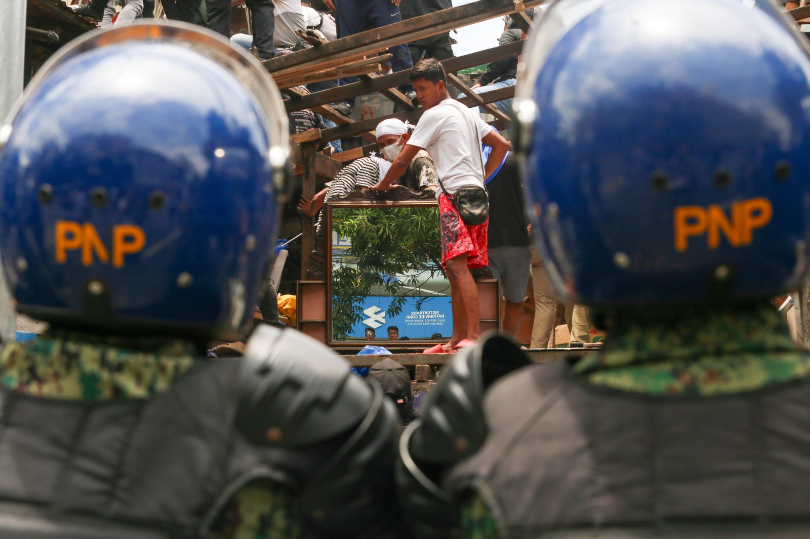 Tension rises amid demolition in Barangay 227, Jose Abad Santos Avenue in Tondo, Manila, on 28 August 2025, as residents clash with the demolition team and police officers.