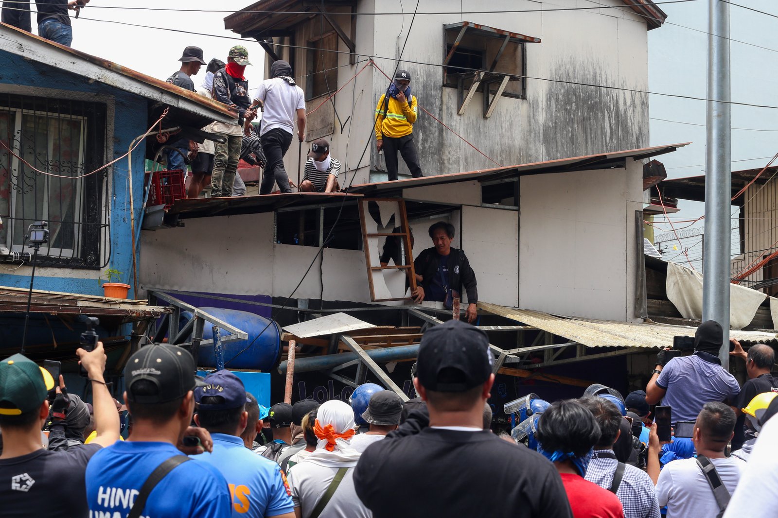 Tension rises amid demolition in Barangay 227, Jose Abad Santos Avenue in Tondo, Manila, on 28 August 2025, as residents clash with the demolition team and police officers.