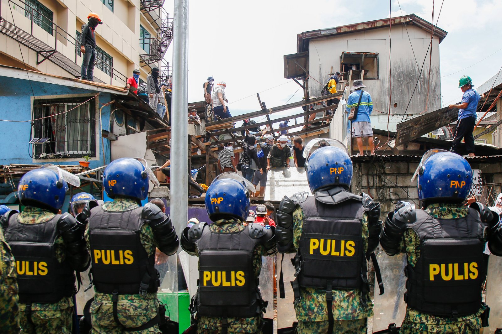 Tension rises amid demolition in Barangay 227, Jose Abad Santos Avenue in Tondo, Manila, on 28 August 2025, as residents clash with the demolition team and police officers.
