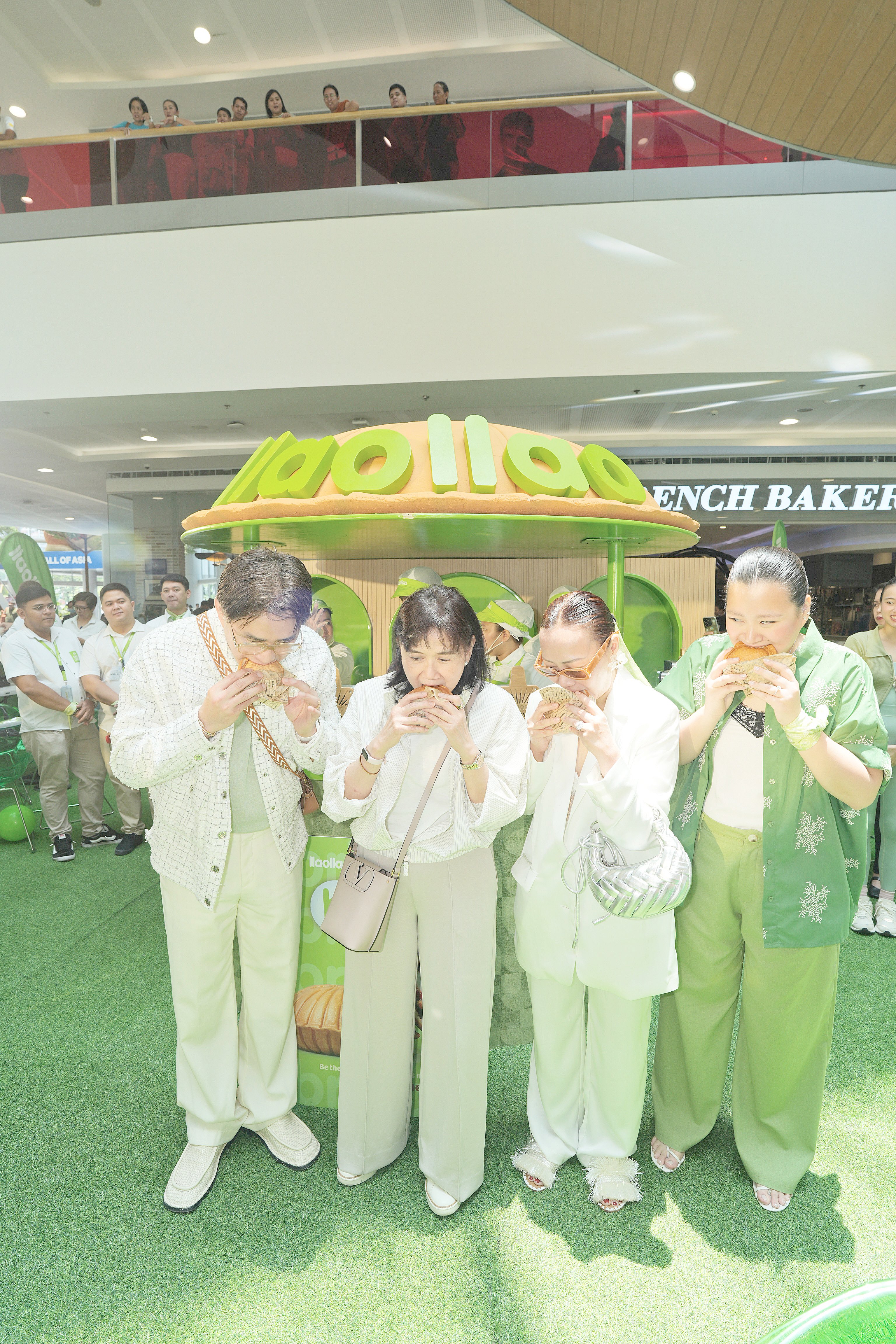 Witnessing the first bite of the new Llao-llao (yogurt) Brioche are Steven Tan, Carol Sy of SM Mall, Beng Dee and Erika Dee of FooDee Global Concepts at the atrium of SM Mall of Asia.