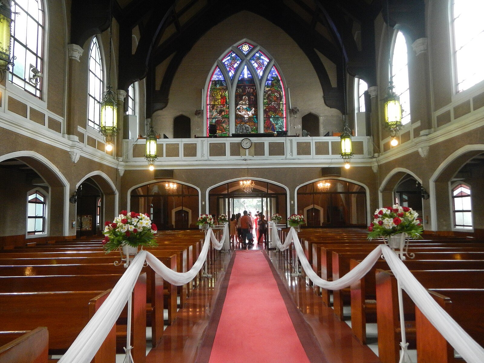 The nave of the Central United Methodist Church features stained glass windows, intricate carvings, and a spacious interior that has witnessed generations of worshippers and historic milestone.