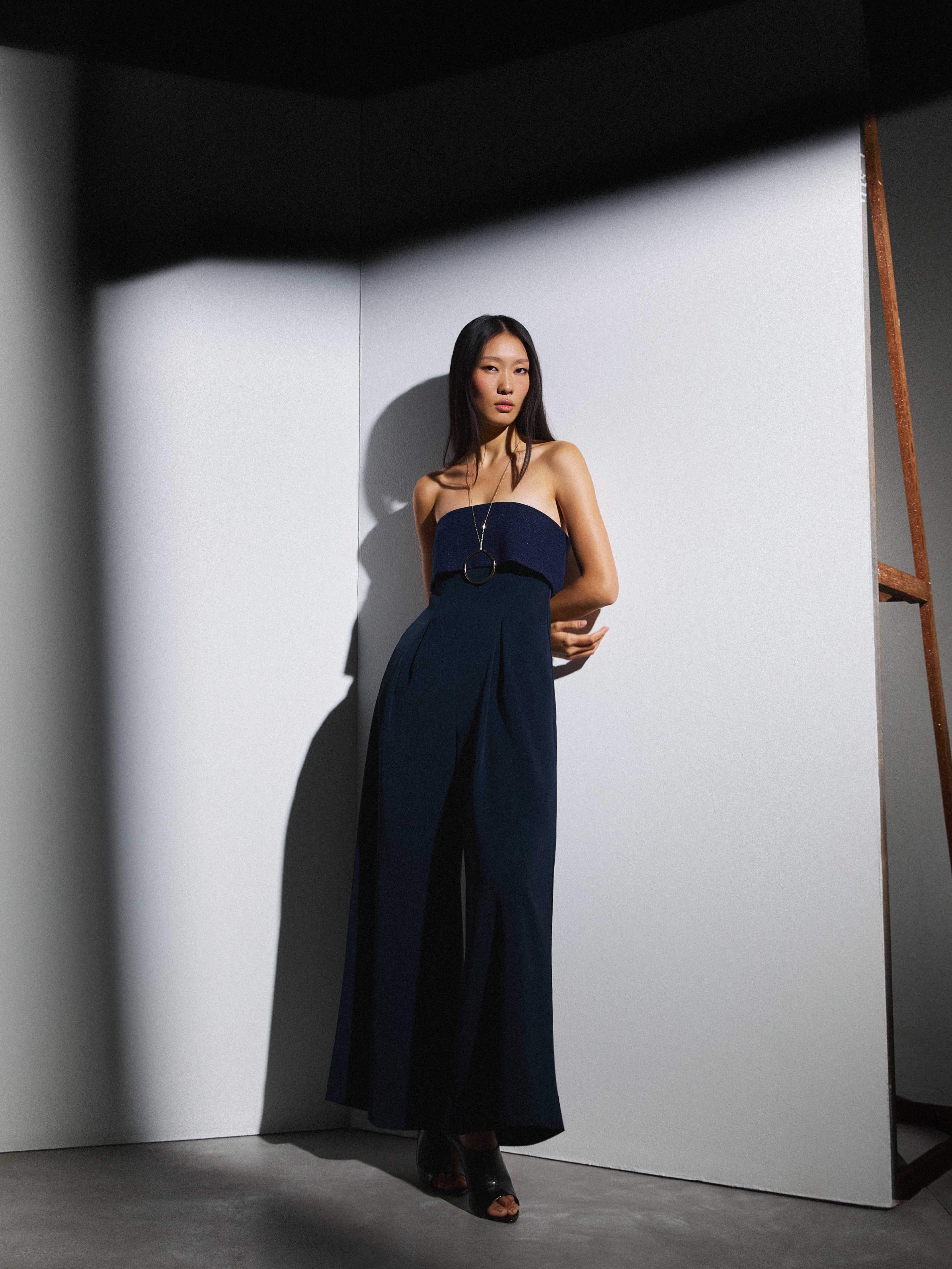 STRAPLESS navy jumpsuit.