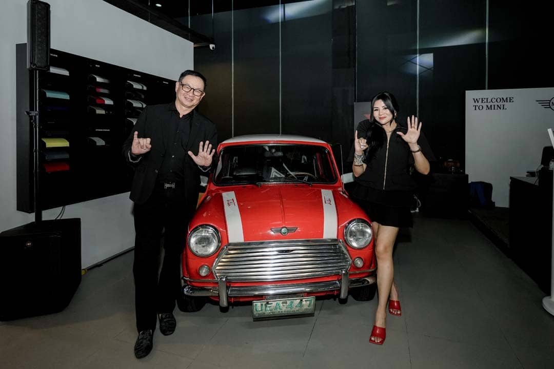 AUTOHUB Group president Willy Tee Ten and chief marketing officer Owee Cruz at the launch of the new MINI John Cooper Works lineup, posing with a classic Mini.
