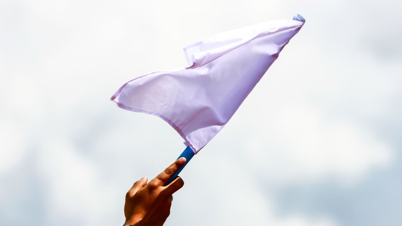 2 Samar insurgents wave 
white flag