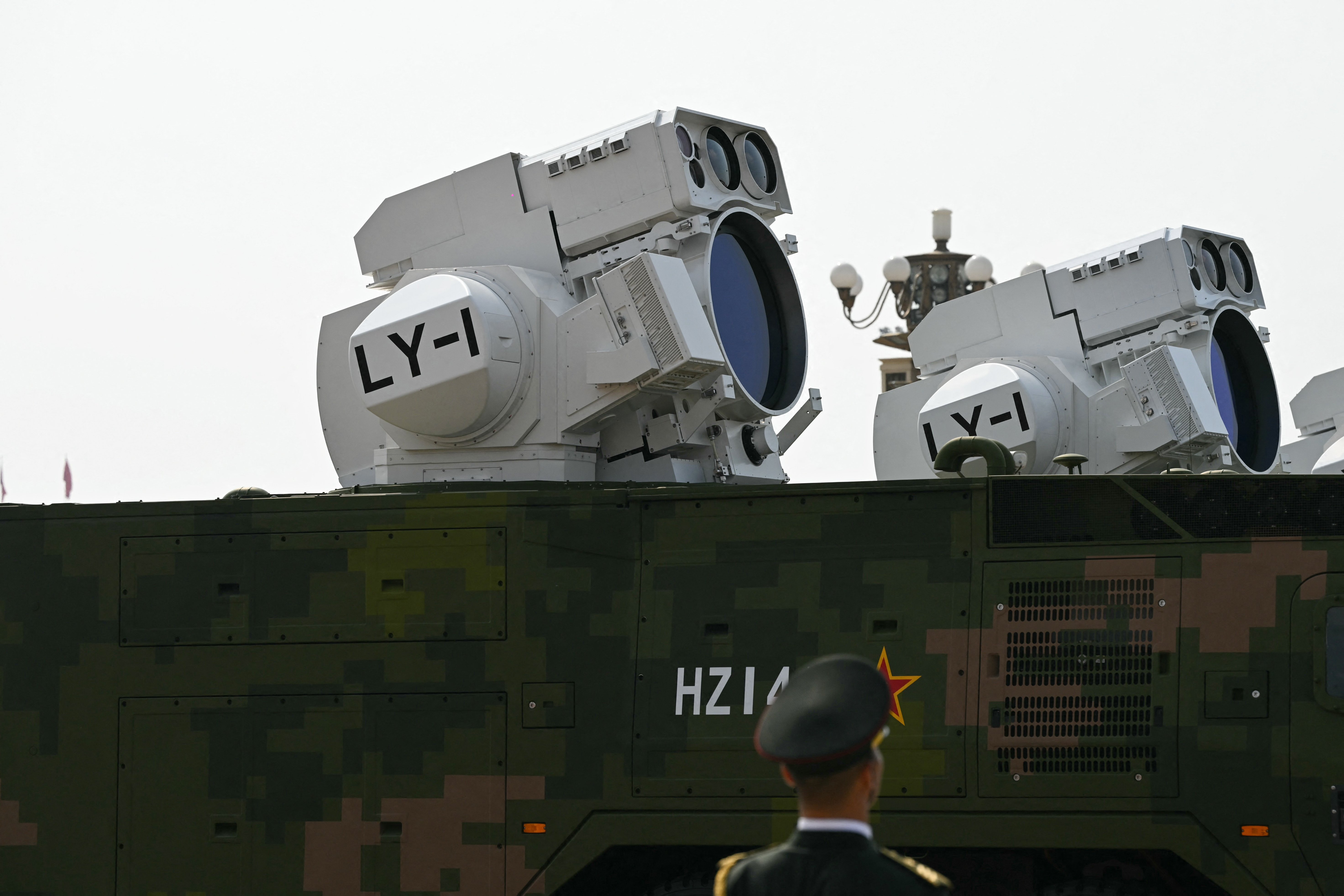 Beijing shows off drones, missiles and lasers in military parade