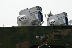Beijing shows off drones, missiles and lasers in military parade