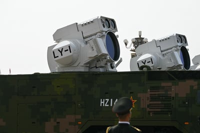 Beijing shows off drones, missiles and lasers in military parade