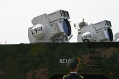 Beijing shows off drones, missiles and lasers in military parade