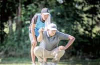KEANU Jahns reads the line of his putt on his way to sharing the lead in the ICTSI Bacolod Challenge at the Bacolod Golf and Country Club on Wednesday.