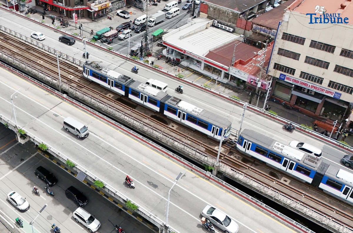 An MRT-3 train passes through Quezon City on Thursday. The Department of Transportation announced that student Beep cards will be available starting September 15, automatically giving passengers a 50 percent fare discount. The cards, valid for one year, can be claimed at MRT and LRT stations upon presentation of a valid school ID or registration, with dedicated printing booths set up in each station.