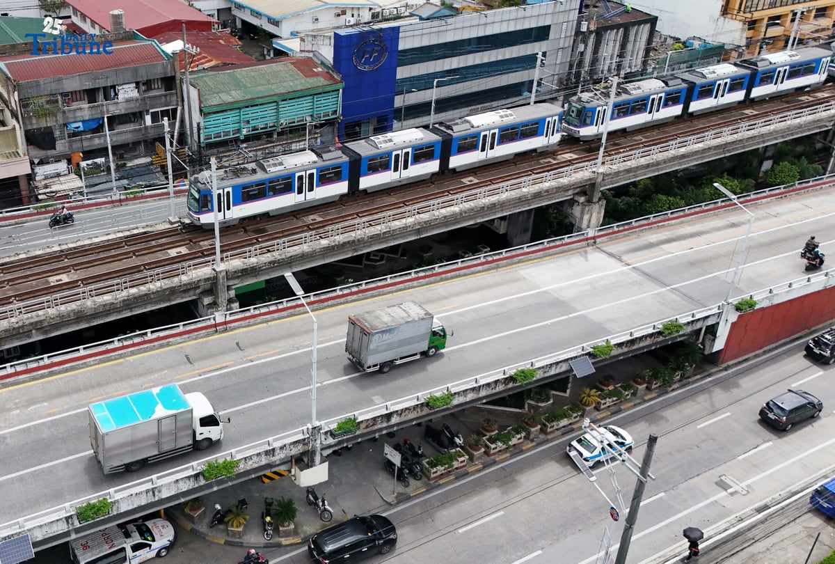 An MRT-3 train passes through Quezon City on Thursday. The Department of Transportation announced that student Beep cards will be available starting September 15, automatically giving passengers a 50 percent fare discount. The cards, valid for one year, can be claimed at MRT and LRT stations upon presentation of a valid school ID or registration, with dedicated printing booths set up in each station.
