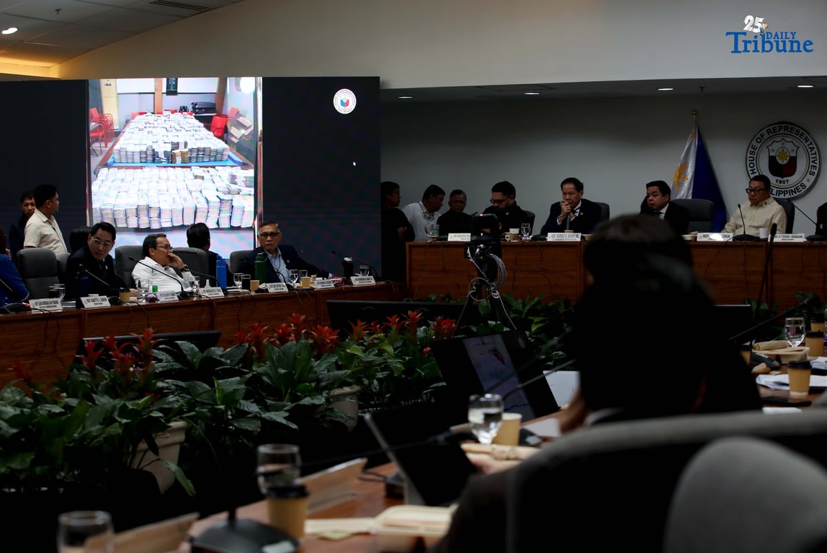 Former DPWH Bulacan 1st District Engineer Brice Ericson Hernandez and former Assistant Engineer JP Mendoza present a photo of Sen. Jinggoy Estrada and a text message from Sen. Joel Villanueva during the House infrastructure committee hearing on alleged flood control anomalies, Tuesday, September 9, 2025. Also in attendance were DPWH officials, contractors, and Pasig City Mayor Vico Sotto.