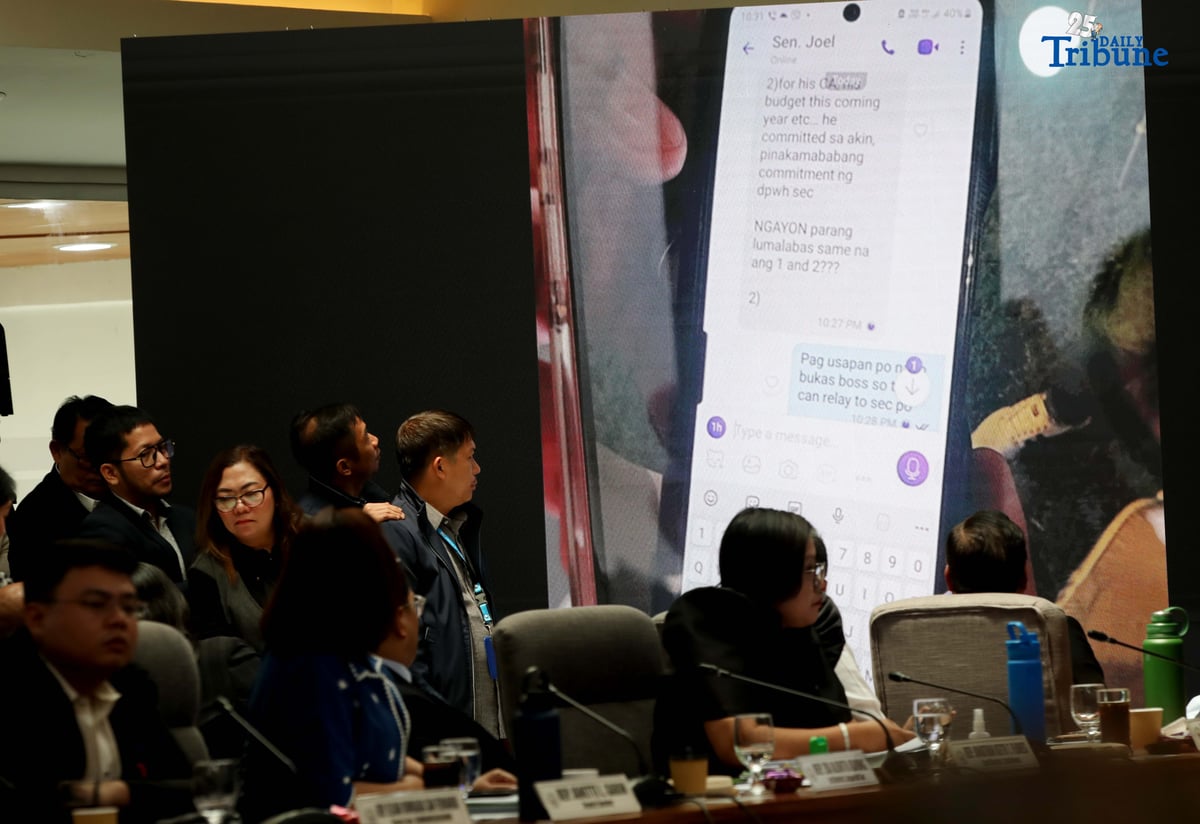 Former DPWH Bulacan 1st District Engineer Brice Ericson Hernandez and former Assistant Engineer JP Mendoza present a photo of Sen. Jinggoy Estrada and a text message from Sen. Joel Villanueva during the House infrastructure committee hearing on alleged flood control anomalies, Tuesday, September 9, 2025. Also in attendance were DPWH officials, contractors, and Pasig City Mayor Vico Sotto.