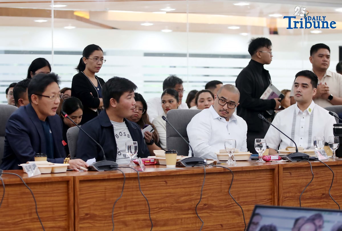 Former DPWH Bulacan 1st District Engineer Brice Ericson Hernandez and former Assistant Engineer JP Mendoza present a photo of Sen. Jinggoy Estrada and a text message from Sen. Joel Villanueva during the House infrastructure committee hearing on alleged flood control anomalies, Tuesday, September 9, 2025. Also in attendance were DPWH officials, contractors, and Pasig City Mayor Vico Sotto.