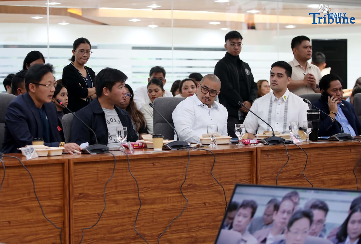 Former DPWH Bulacan 1st District Engineer Brice Ericson Hernandez and former Assistant Engineer JP Mendoza present a photo of Sen. Jinggoy Estrada and a text message from Sen. Joel Villanueva during the House infrastructure committee hearing on alleged flood control anomalies, Tuesday, September 9, 2025. Also in attendance were DPWH officials, contractors, and Pasig City Mayor Vico Sotto.