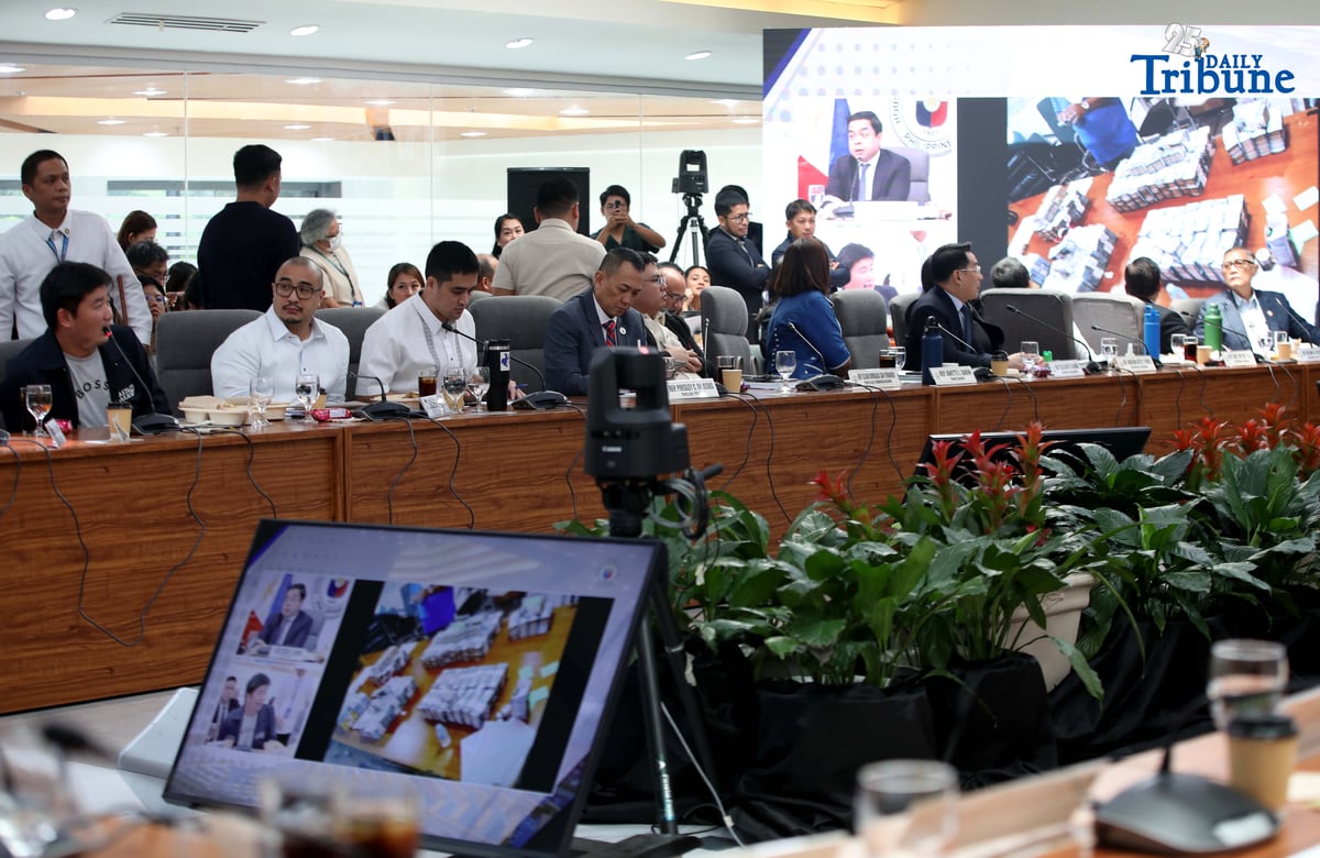 Former DPWH Bulacan 1st District Engineer Brice Ericson Hernandez and former Assistant Engineer JP Mendoza present a photo of Sen. Jinggoy Estrada and a text message from Sen. Joel Villanueva during the House infrastructure committee hearing on alleged flood control anomalies, Tuesday, September 9, 2025. Also in attendance were DPWH officials, contractors, and Pasig City Mayor Vico Sotto.