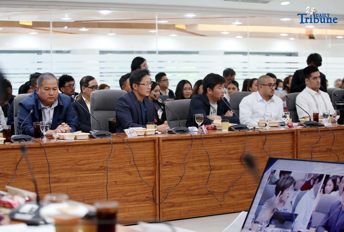 Former DPWH Bulacan 1st District Engineer Brice Ericson Hernandez and former Assistant Engineer JP Mendoza present a photo of Sen. Jinggoy Estrada and a text message from Sen. Joel Villanueva during the House infrastructure committee hearing on alleged flood control anomalies, Tuesday, September 9, 2025. Also in attendance were DPWH officials, contractors, and Pasig City Mayor Vico Sotto.