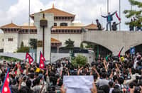 Demonstrators gather outside Nepal’s Parliament during a protest in Kathmandu on 8 September 2025, against social media prohibitions and corruption by the government. Nepal police opened fire, killing at least 17 people as thousands of young protesters took to the streets of Kathmandu demanding the government lift a social media ban and tackle corruption.