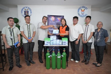 Officials from the Philippine Charity Sweepstakes Office turn over medical equipment to Casimiro A. Ynares Sr. Memorial National High School.