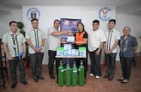 Officials from the Philippine Charity Sweepstakes Office turn over medical equipment to Casimiro A. Ynares Sr. Memorial National High School.